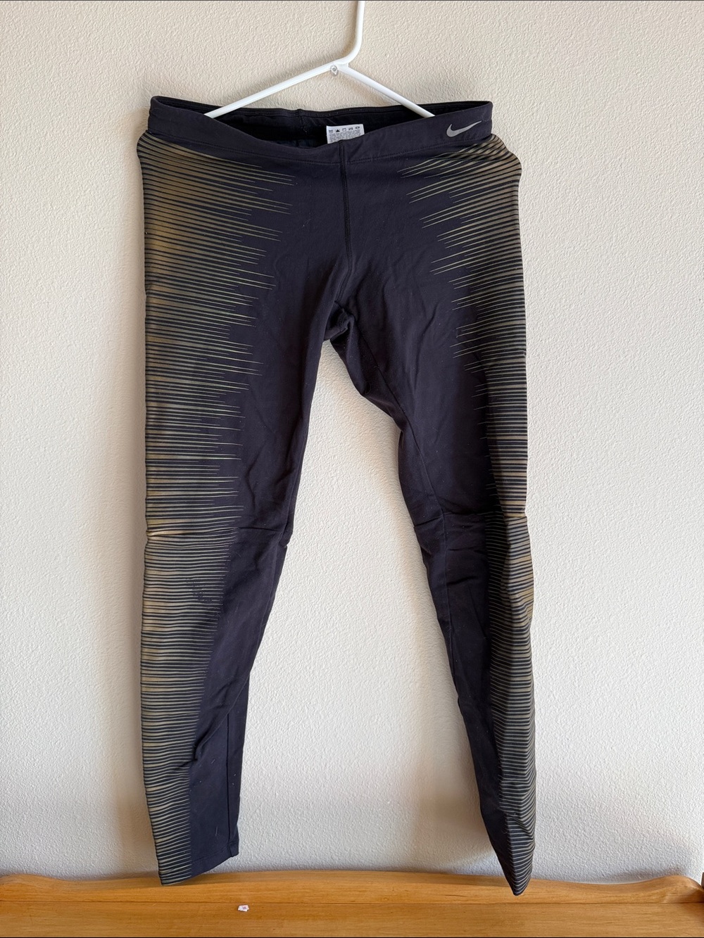 Nike Black Leggings with Gold Accent Stripe